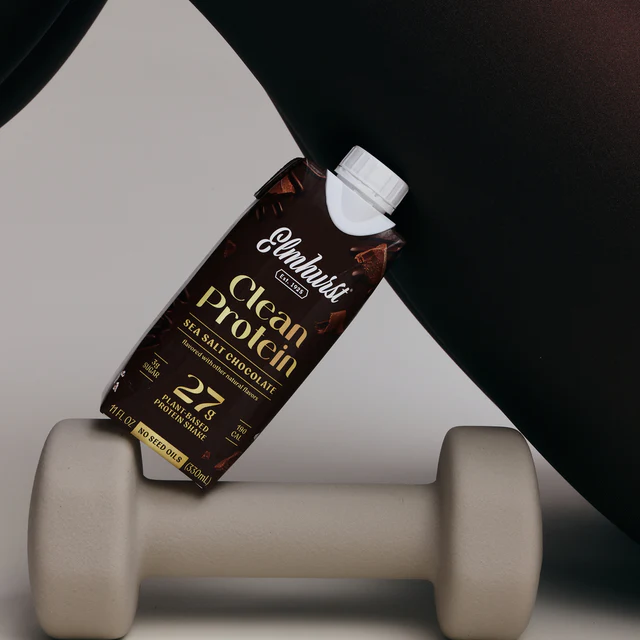 Clean Protein in Sea Salt Chocolate flavor balancing on top of a weight.