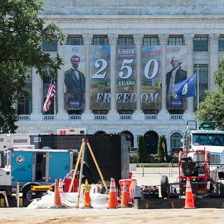 Workers continue to build the stage for Freedom 250's Great American State Fair on the National Mall on May 28, 2026, in Washington, DC.