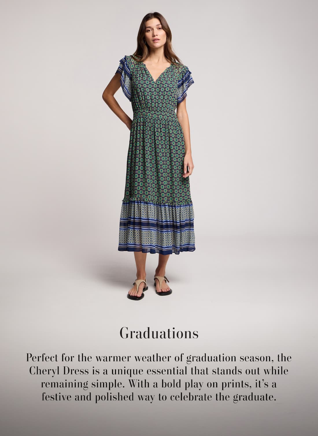 Model wearing Cheryl Dress. Text reads: Graduations - Perfect for the warmer weather of graduation season, the Cheryl Dress is a unique essential that stands out while remaining simple. With a bold play on prints, it's a festive and polished way to celebrate the graduate.