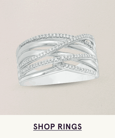 Wide silver ring with multiple crisscrossing bands, some accented with pavé-set diamonds. Click here to shop rings