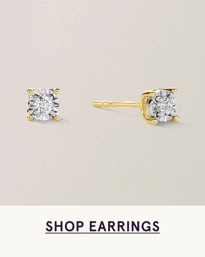 Pair of circle-cut diamond studs set in yellow gold  with four-prong baskets. Click here to shop earrings