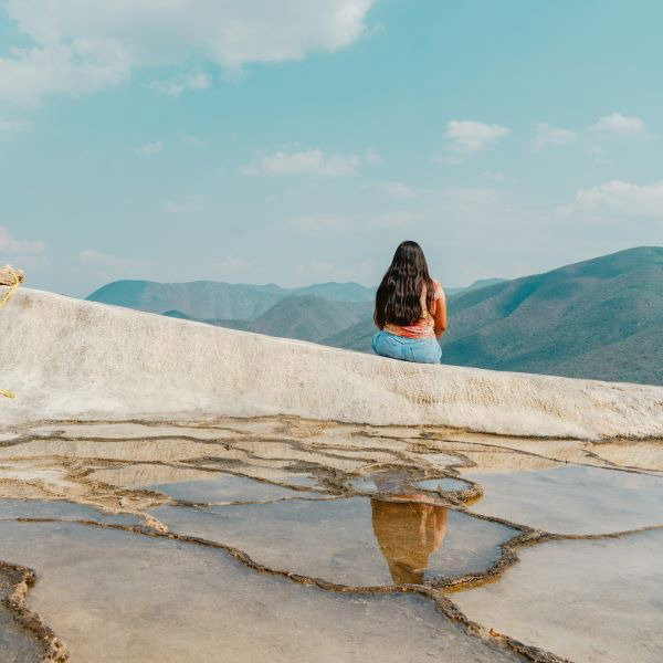 A woman sat at a viewpoint in Oaxaca.