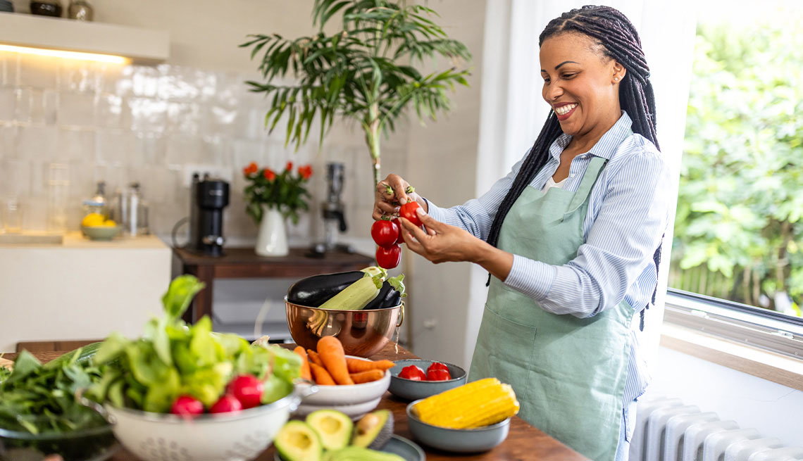 African American Adult Woman Cooking with Vegetables