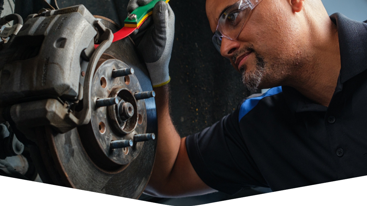 Technician working on brakes