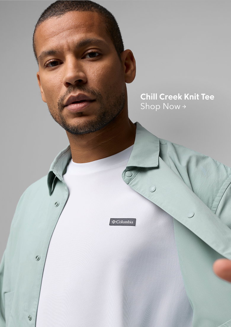 A man wearing a white shirt and light blue button up with text: Chill Creek Knit Tee
