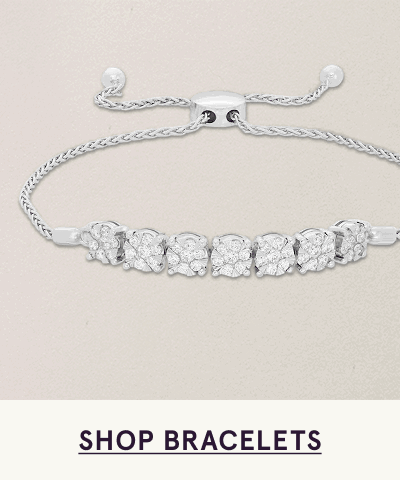 Silver bolo-style adjustable bracelet with horizontal row of circle-cut diamonds on front. Click here to shop bracelets
