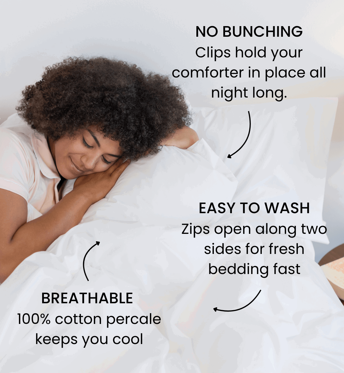 A woman sleeps soundly in bed with a white duvet cover. 