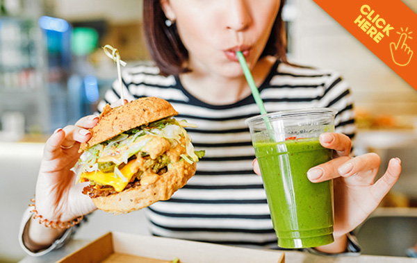 Click Here - Woman sipping smoothie & eating delicious sandwich