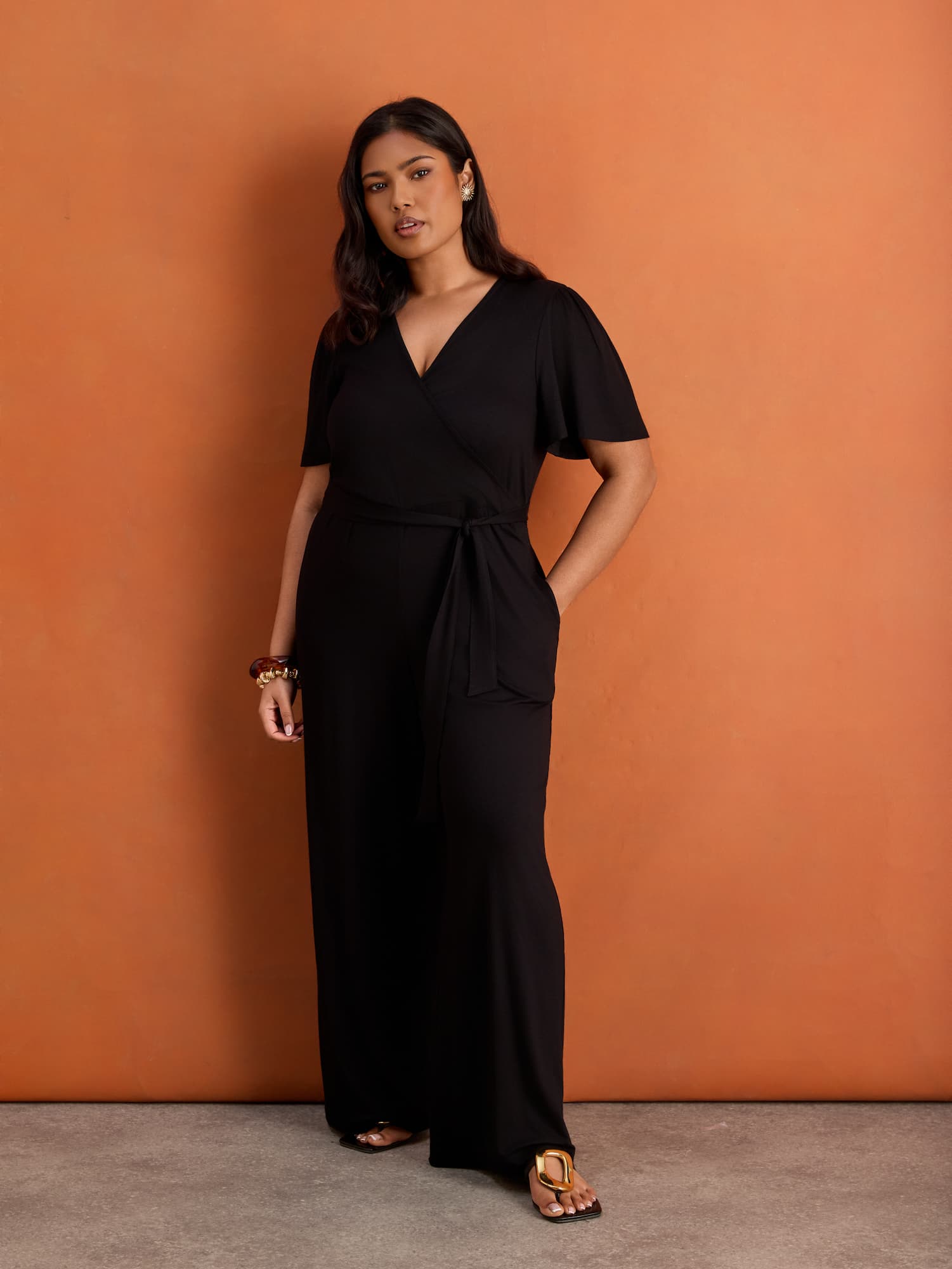 Black V Neck Wrap Flutter Sleeve Jersey Jumpsuit