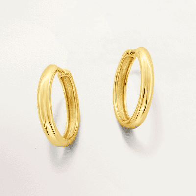 A pair of gold hoop earrings.