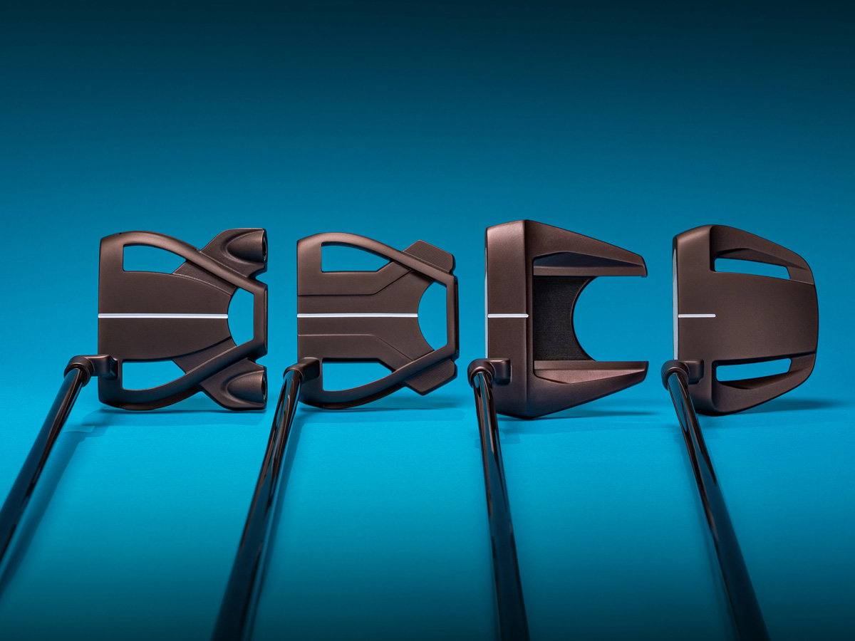 All-new Spider Tour Putter, Spider Tour X Putter, Spider Tour F Putter and Spider Tour V Putter next to each other on a blue background.