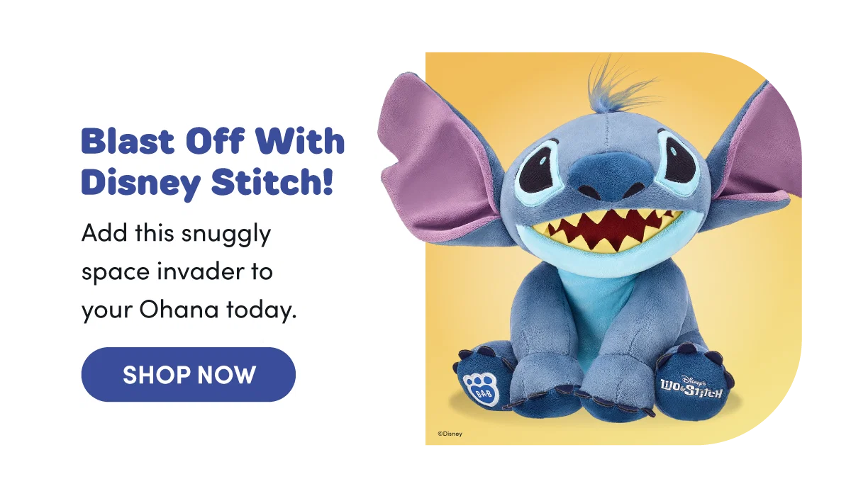  Warm yellow backdrop on the right featuring a large blue Stitch plush from Disney Lilo & Stitch with wide ears, toothy smile, and visible paw pad logos, seated facing forward.Text reads: Blast Off With Disney Stitch! Add this snuggly space invader to your Ohana today. SHOP NOW