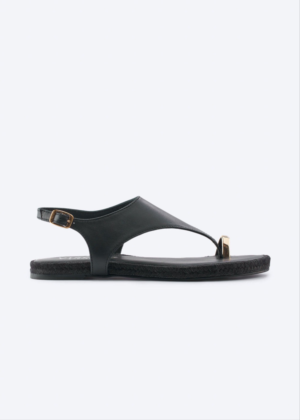 Black leather thong sandal with slim ankle strap, flat sole, and open silhouette for effortless seaside days