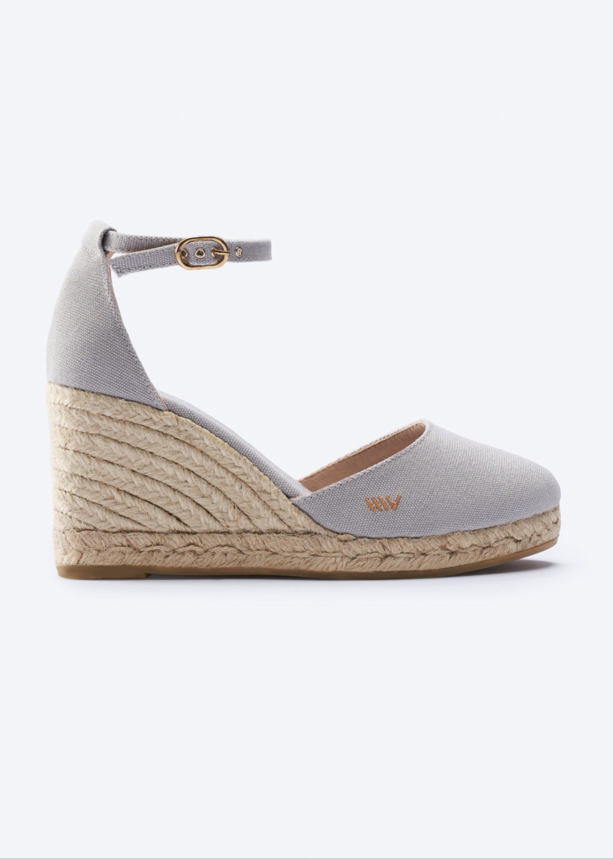 Light gray wedge espadrille sandal with ankle strap, closed toe, and braided jute heel for sunny summer outings