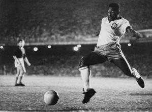 Pele stretching for a soccer ball