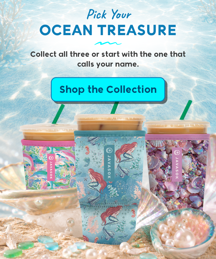 Three ocean-themed insulated tumblers displayed on a sandy beach with seashells and pearls.