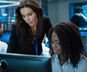 image-two-people-monitors-office