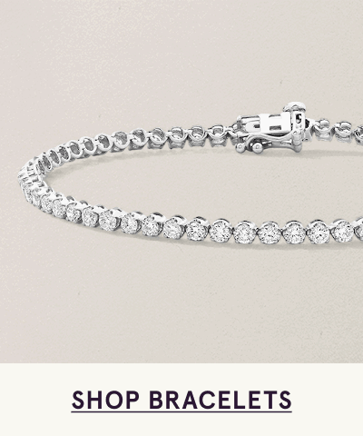 Classic diamond tennis bracelet featuring continuous line of round-cut stones. Click here to shop bracelets