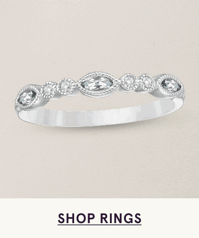 Slender silver band with alternating round & marquise-shaped diamond settings. Click here to shop rings