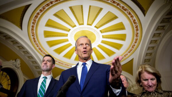 Senate Majority Leader John Thune, R-S.D., center, speaks to reporters at the U.S. Capitol.
