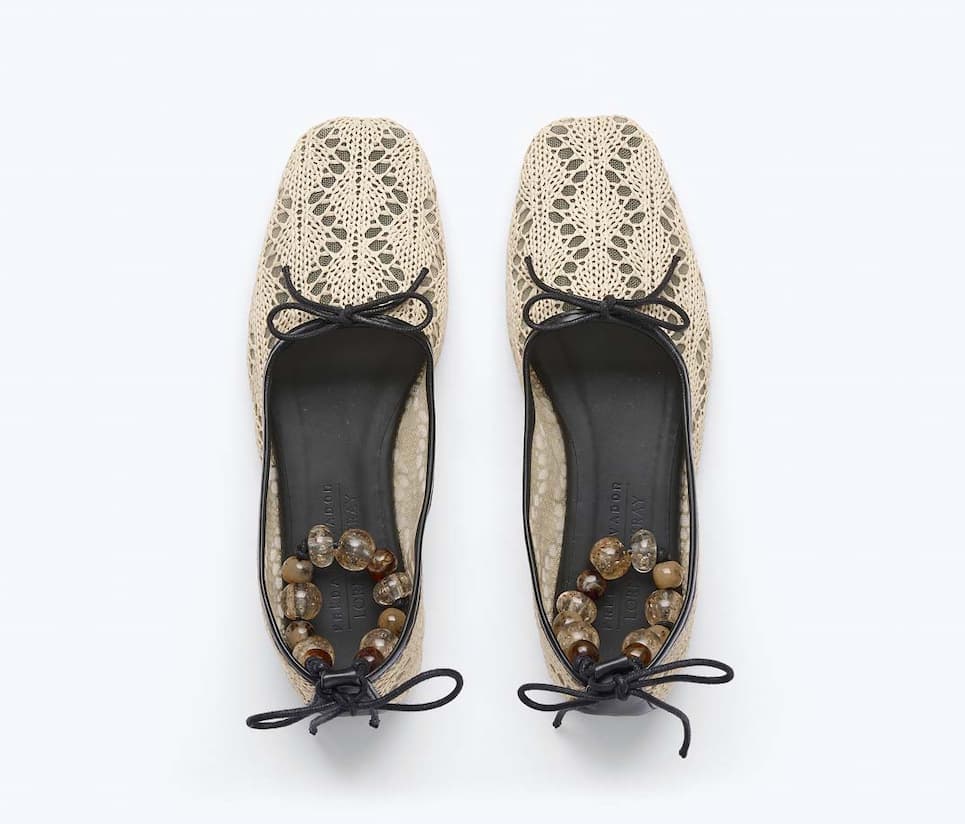 Ballet flats in woven raffia with beaded ankle lace