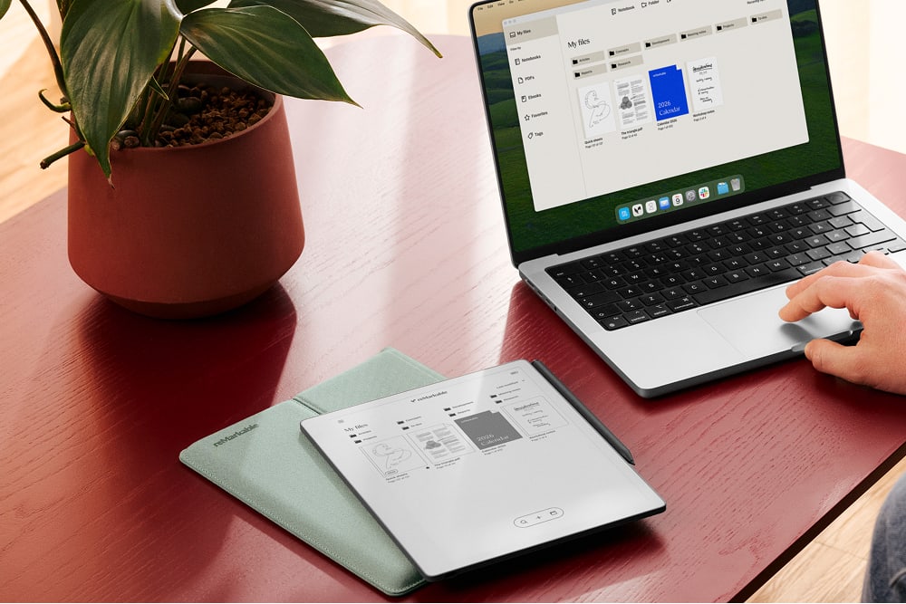 reMarkable Paper Pure next to someone working on a Mac