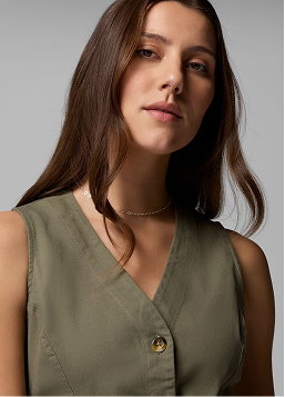 A woman wearing an olive dress