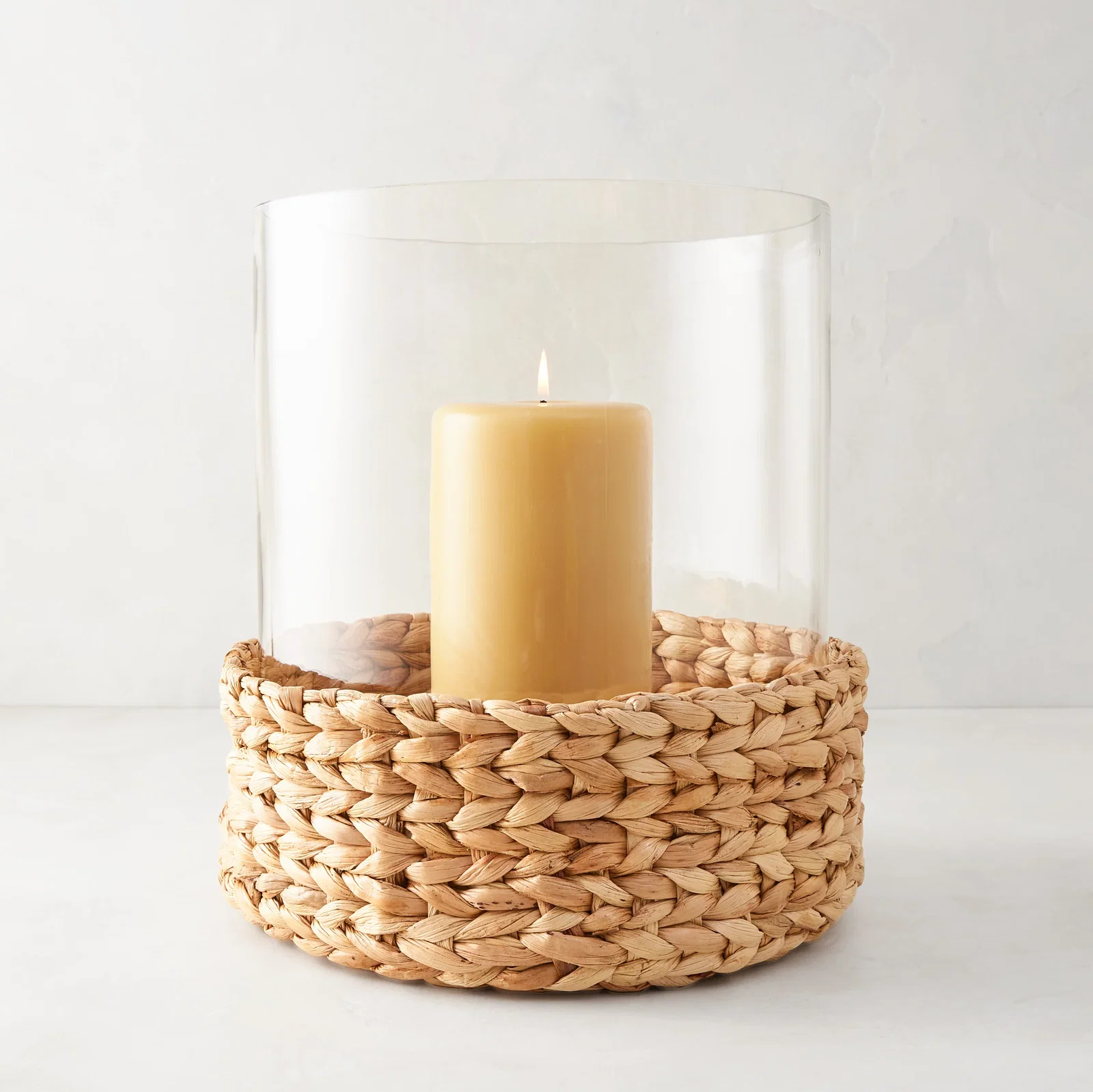 Image of Large Glass Hurricane with Woven Hyacinth Base