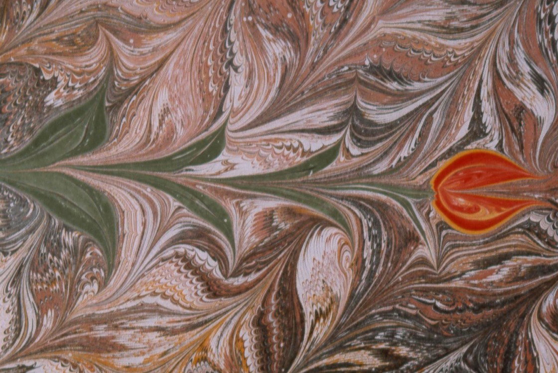 Marbled paper of a tulip on combed ground. 