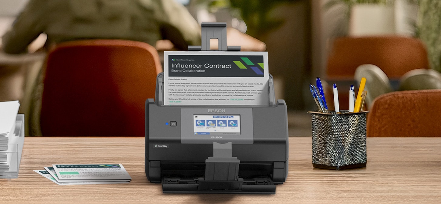 Image: the WorkForce ES-590 on a table in a cafe style environment