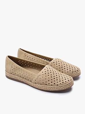 Beige slip-on espadrilles with perforated design on a white background