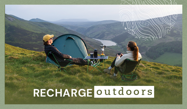 RECHARGE OUTDOORS. A man and a woman sit on Highlander Ayr Folding Chairs, overlooking a valley. A Highlander Respite 2 Tent is pitched behind them.