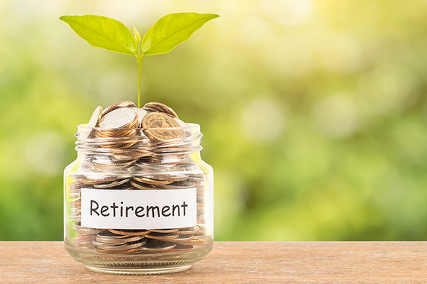 A coin jar labeled for retirement.