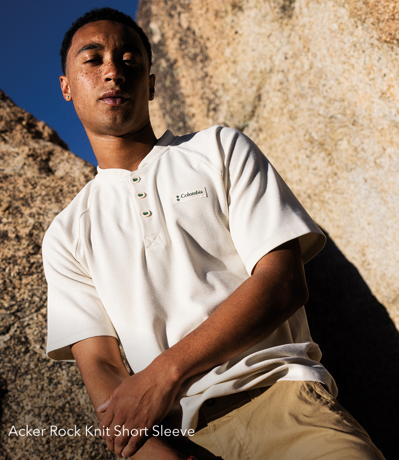 A man wearing the Acker Rock shirt