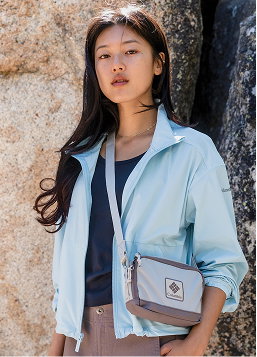 A woman wearing a blue jacket
