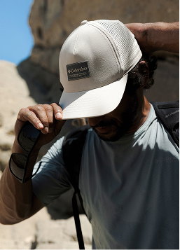 Man adjusting his ballcap