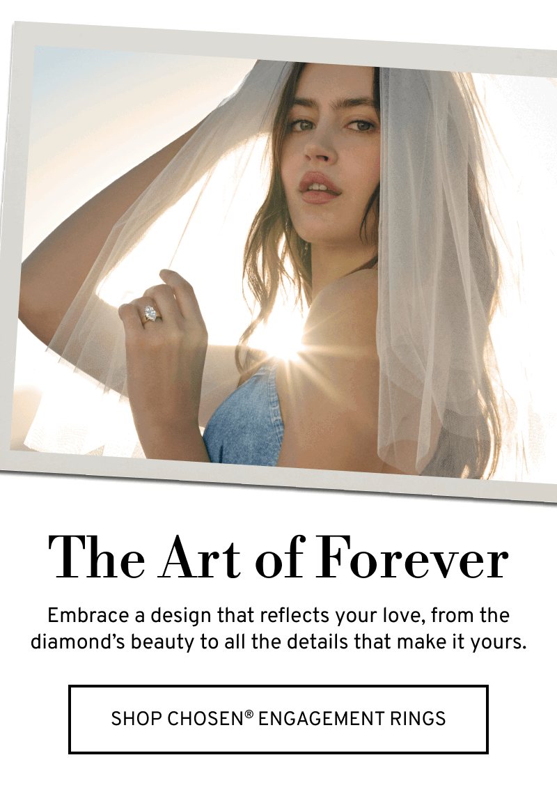 Sunlit model wearing a veil and diamond ring. The Art of Forever. Make it yours. Click to Shop Chosen Engagement Rings