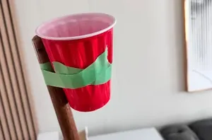Stick a plastic cup to a broomstick for this clever party decoration hack 🎈