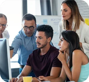 image-team-gathered-around-a-computer