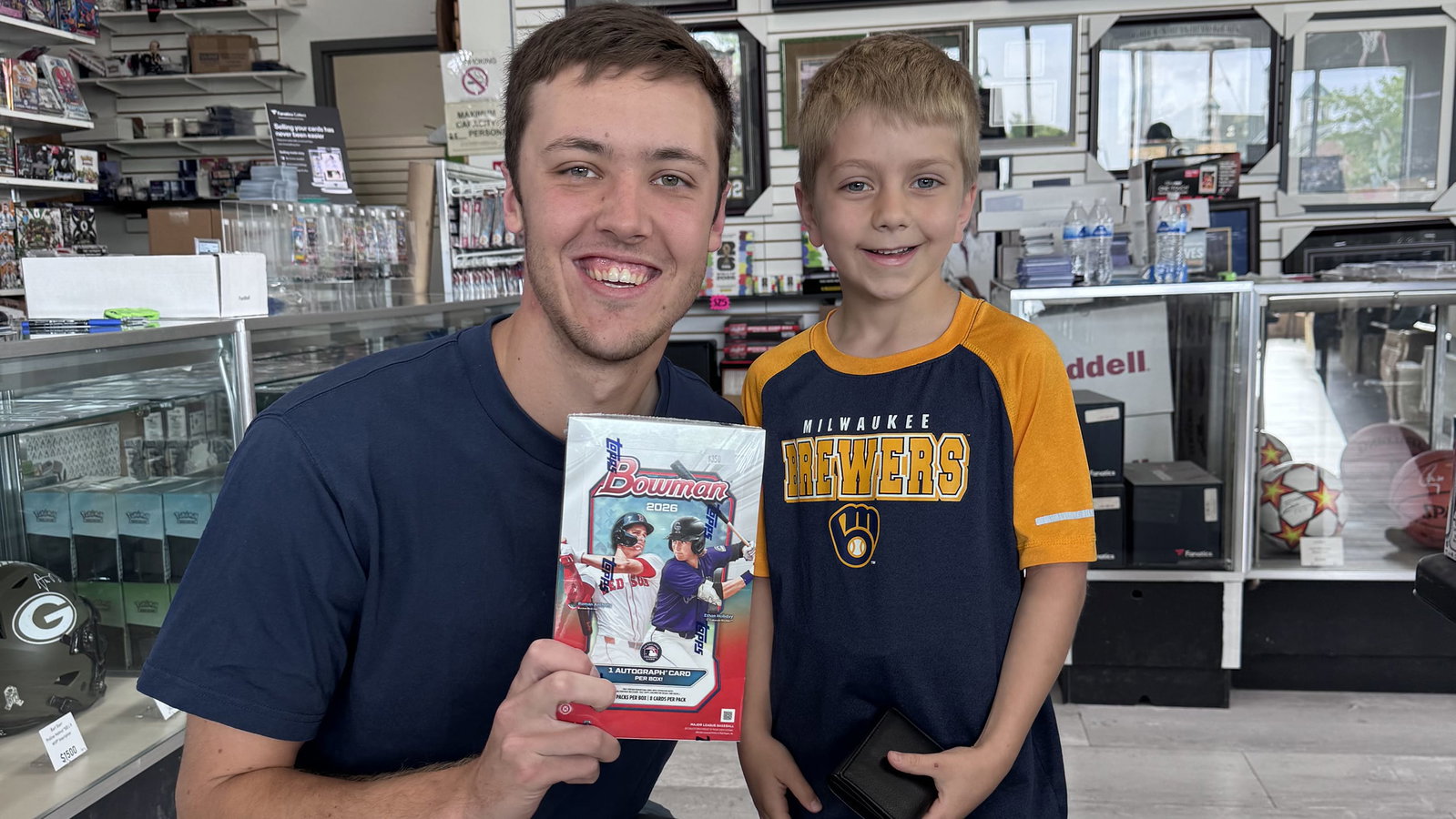 Jacob Misiorowski poses for a picture with a young fan who pulled his baseball card