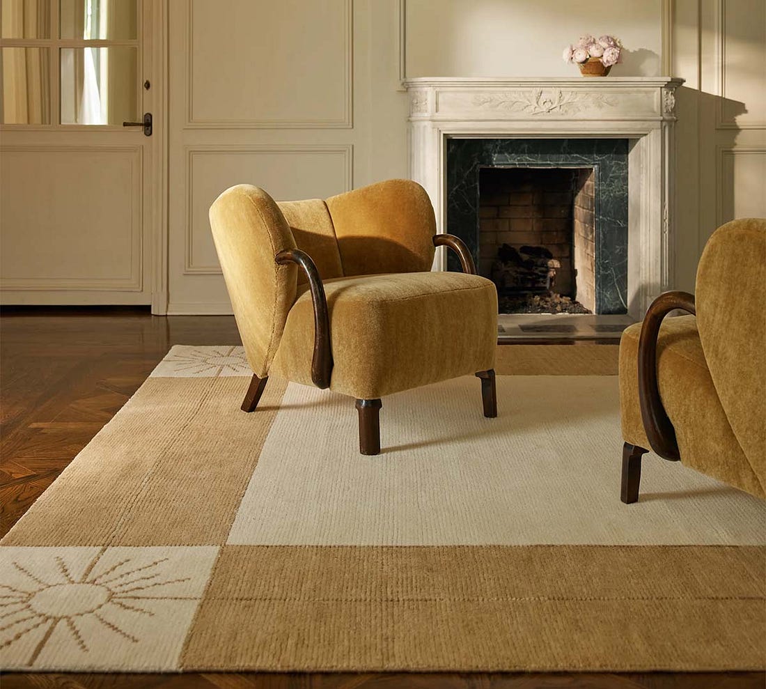 Living room with neutral rug and velvet chairs