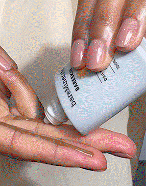 Model applying Bareskin daily dewy spf