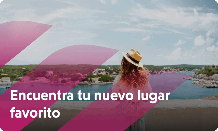 Una mujer con sombrero y mochila está de pie junto a un muro y mira hacia un río. Ahora hay que encontrar un nuevo lugar favorito.