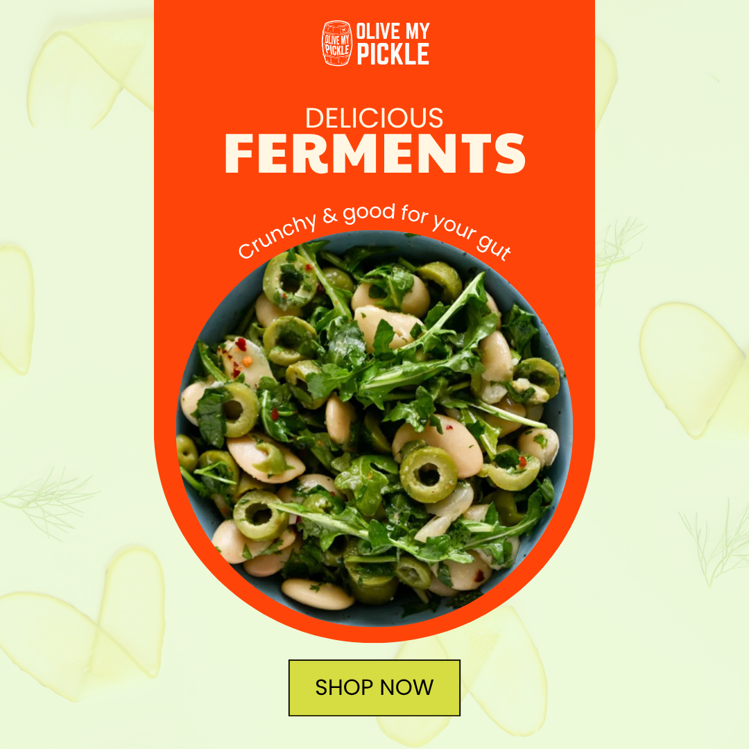 A bowl of green olives, white beans, and arugula ferment with 'OLIVE MY PICKLE' branding and promotional text on a colorful background.