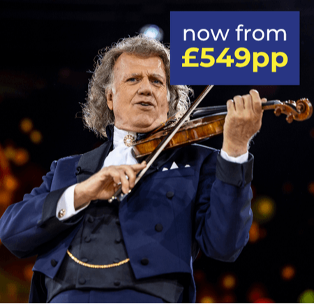A man in a blue suit plays the violin on stage, with a vibrant background and promotional text.