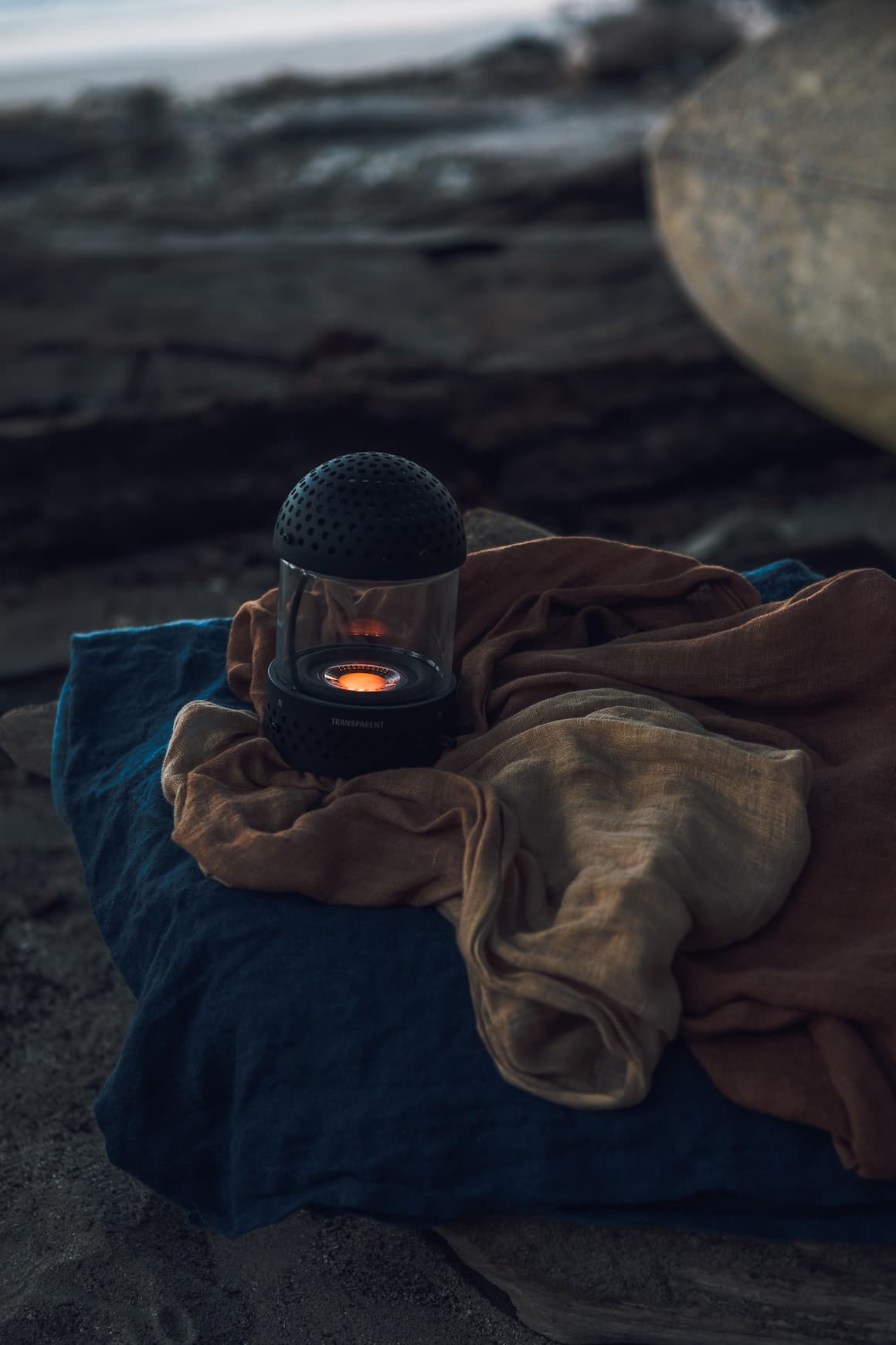 Transparent Light Speaker in Black on a blanket