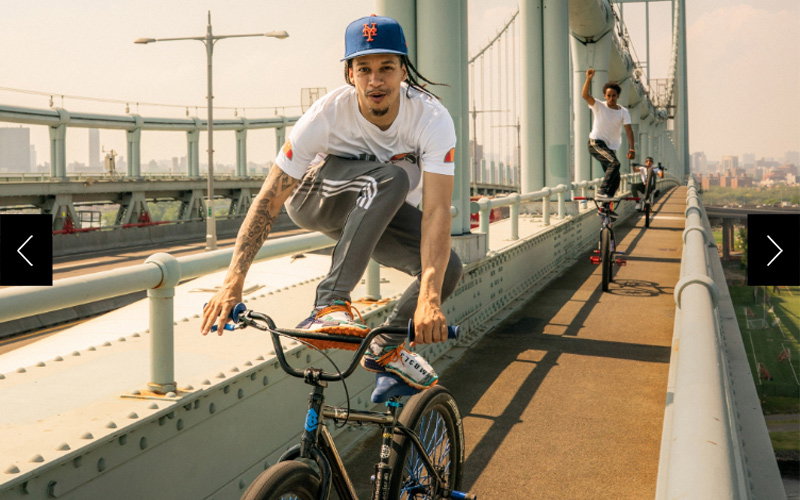 Bike riders “surf” on their bikes across a bridge