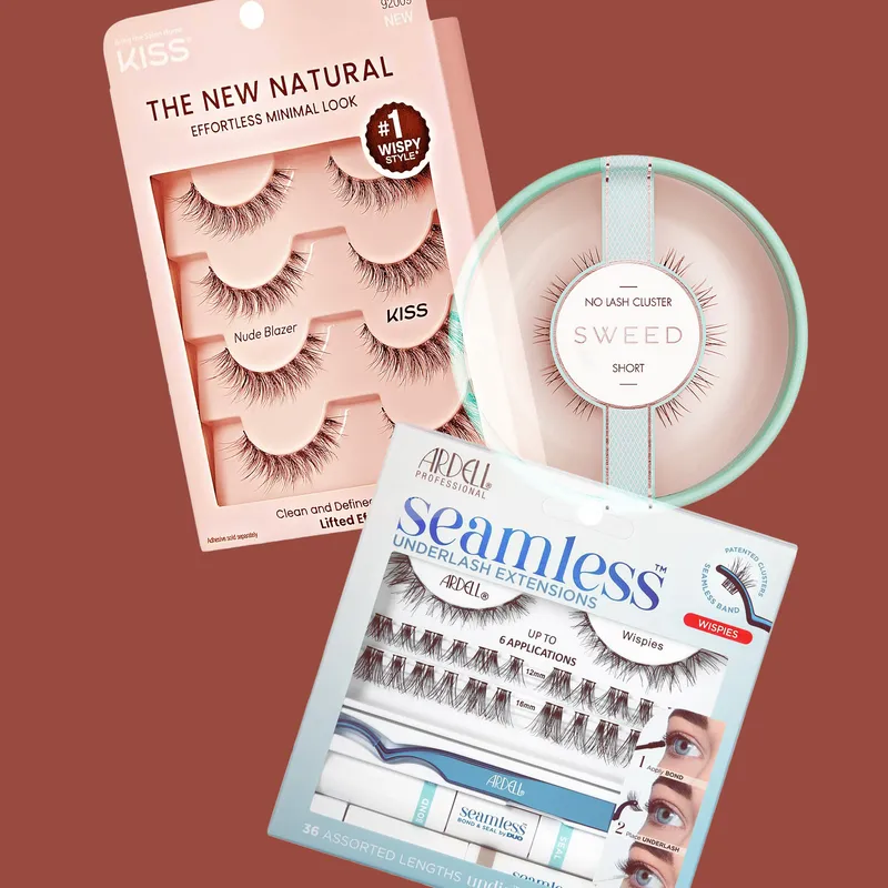 3 packages of false eyelashes overlapping on a burnt sienna colored background. Product brands include KISS, Ardell, and Sweed.