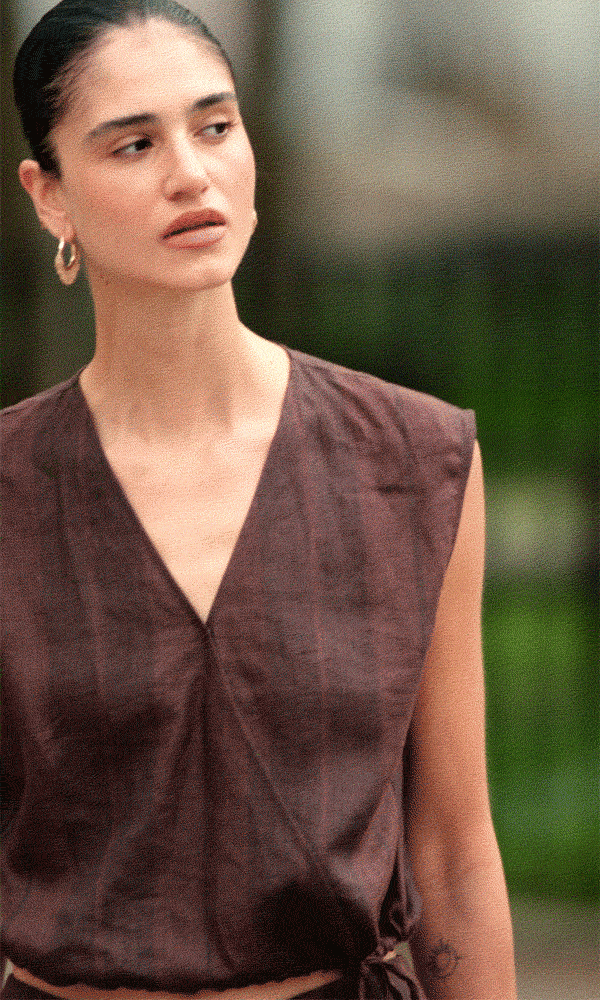 GIF of model wearing Autograph Pure Flax Linen Striped Wrap Top and Autograph Pure Flax Linen Striped Wide Leg Trousers in Brown Mix