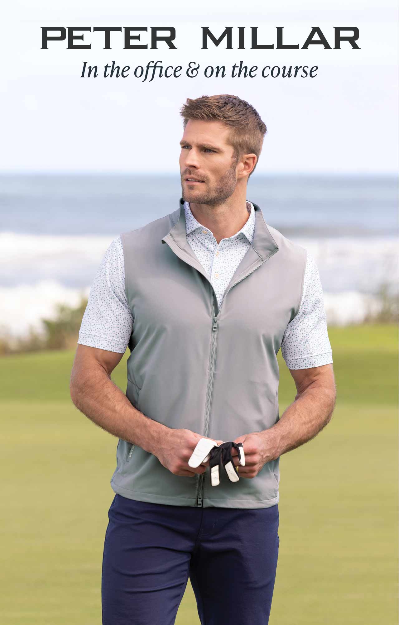 Peter Millar — In the office & on the course. Man wearing gray vest and print polo on the golf course.